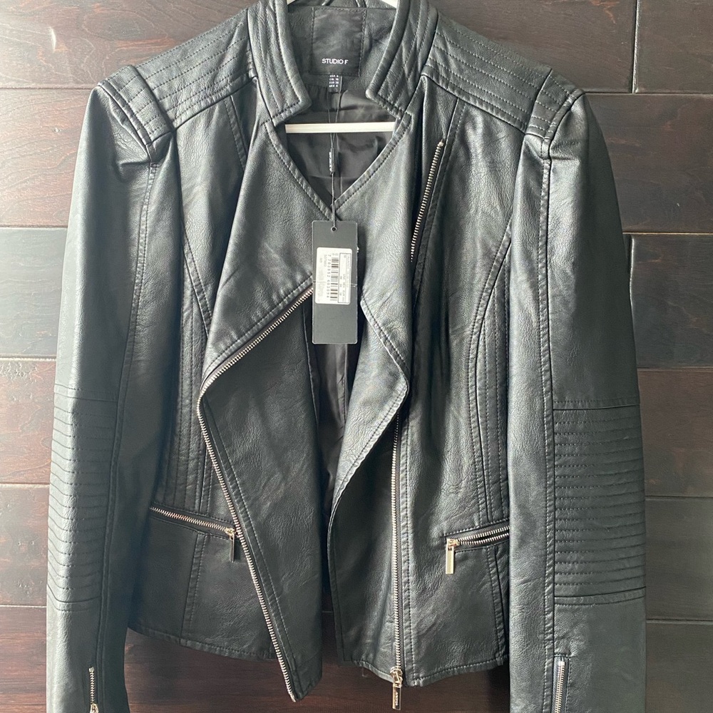 Beautiful woman new black leather jacket
